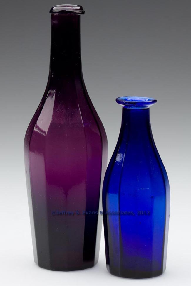 BLOWN-MOLDED PANELED COMMERCIAL COLOGNE BOTTLES, L: BLOWN-MOLDED PANELED COMMERCIAL COLOGNE BOTTLES, LOT OF TWO, deep sapphire blue and medium amethyst, each shouldered form with 12 panels, blue example with flanged mouth and amethyst example with a cr