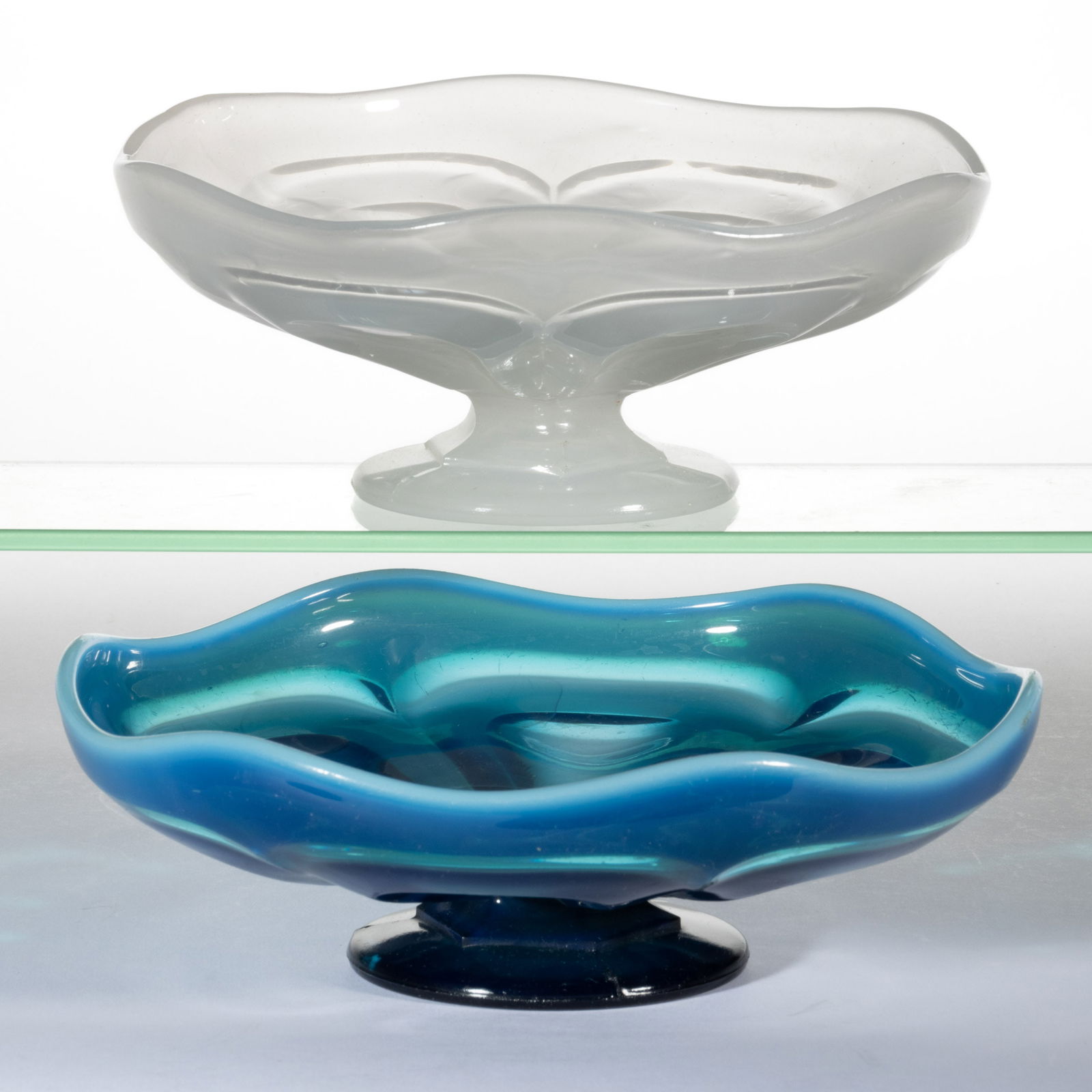 PRESSED O'HARA / LOOP LOW FOOTED BOWLS, LOT OF TWO: PRESSED O'HARA / LOOP LOW FOOTED BOWLS, LOT OF TWO, comprising a swirling opalescent turquoise blue and an alabaster/clambroth, each having a shallow bowl with six loops and conforming rim scallop