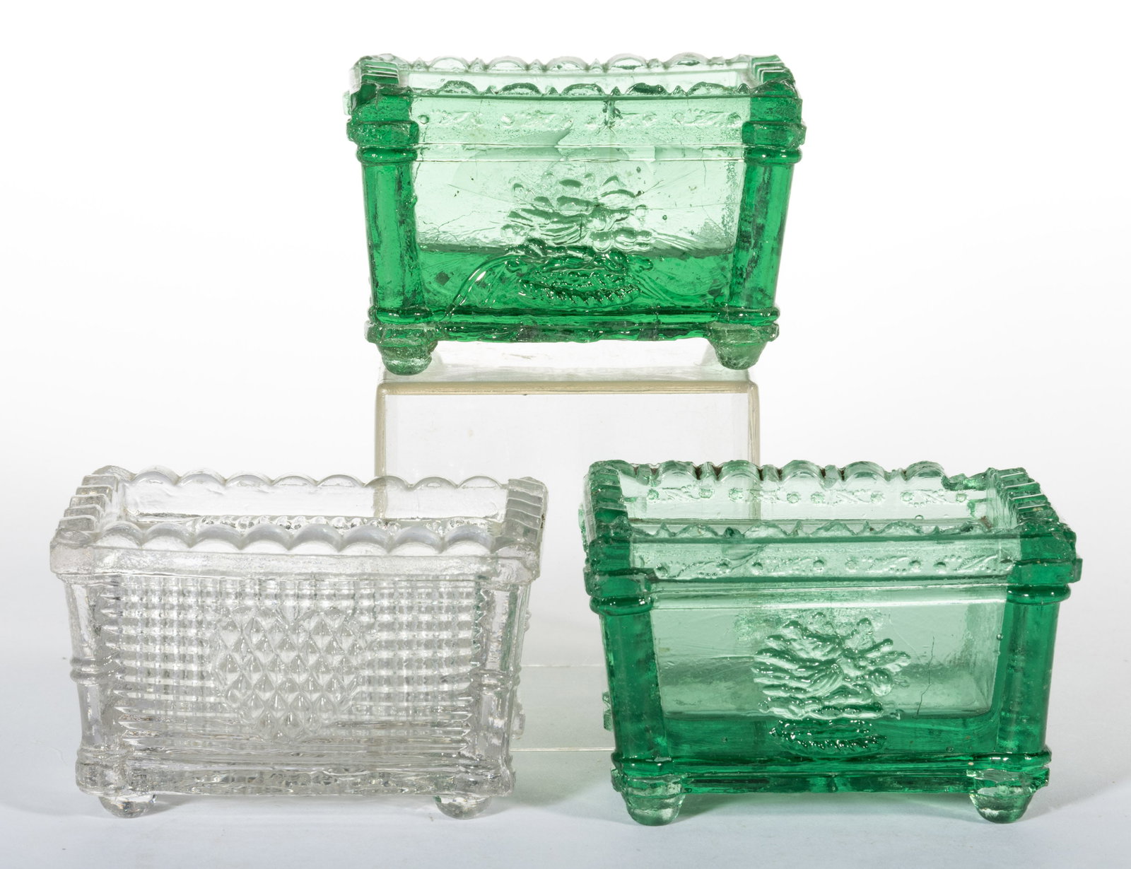 NE-6 NEW ENGLAND UNMARKED PRESSED PAIR OF OPEN SALTS: NE-6 NEW ENGLAND UNMARKED PRESSED PAIR OF OPEN SALTS, light green, 12-point star under base, scallop and point rim. Rare. Together with a colorless OG-2. Jersey Glass Co. or New England Glass Co. Circ
