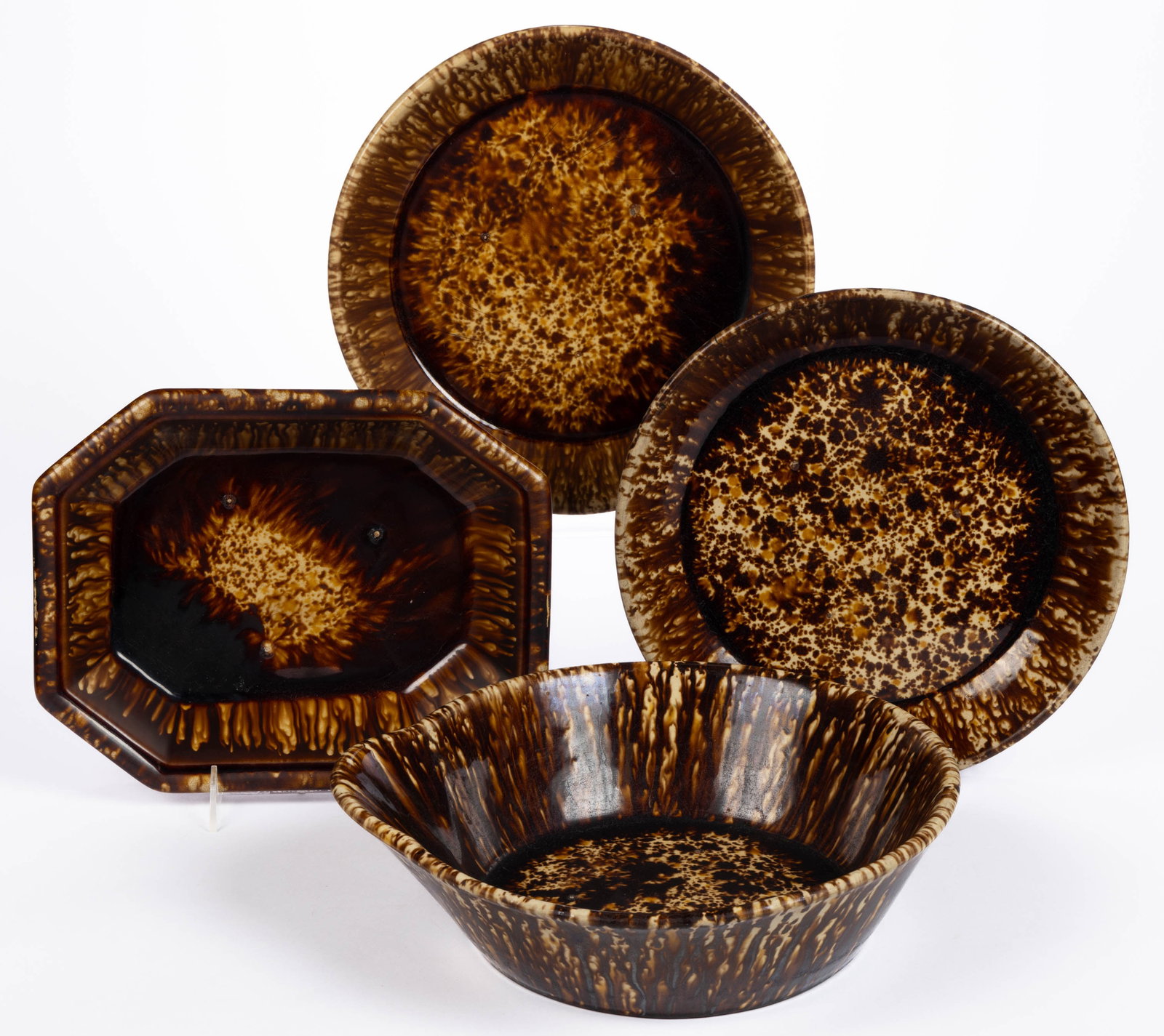 AMERICAN STAMPED BENNINGTON FLINT ENAMEL POTTERY KITCHEN ARTICLES, LOT OF FOUR: AMERICAN STAMPED BENNINGTON FLINT ENAMEL POTTERY KITCHEN ARTICLES, LOT OF FOUR, mottled brown and orange glaze, comprising one octagonal-form baking dish, one mixing bowl with spout, and two