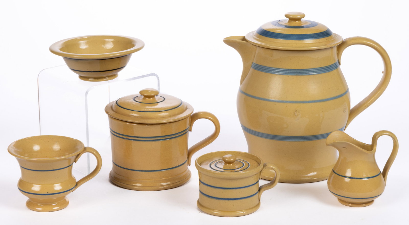 AMERICAN / BRITISH YELLOWWARE ARTICLES, LOT OF SIX: AMERICAN / BRITISH YELLOWWARE ARTICLES, LOT OF SIX, comprising five examples with incised blue band decoration including a covered mustard pot, a covered mug, a covered jug/pitcher with ice guard