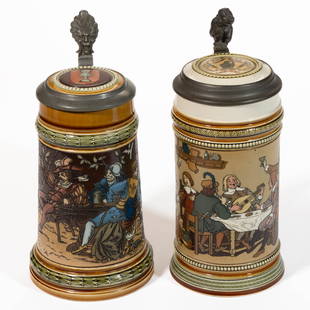 GERMAN METTLACH SINGING AND DRINKING MOTIF CERAMIC STEINS, LOT OF TWO: GERMAN METTLACH SINGING AND DRINKING MOTIF CERAMIC STEINS, LOT OF TWO, mold numbers 1527 and 2532, each having etched sides with polychrome hand-painted decorations, ceramic inset lids, 