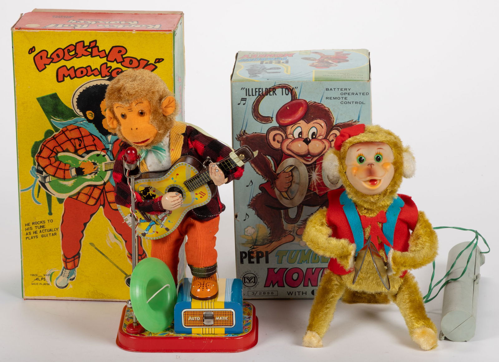 ASSORTED VINTAGE BATTERY POWERED MUSIC PERFORMING MONKEYS, LOT OF TWO: ASSORTED VINTAGE BATTERY POWERED MUSIC PERFORMING MONKEYS, LOT OF TWO, comprising a Yanoman Toys "Illfelder Toy" Pepi tumbling monkey with cymbal; and an Alps "Rock'n Roll Monkey&qu