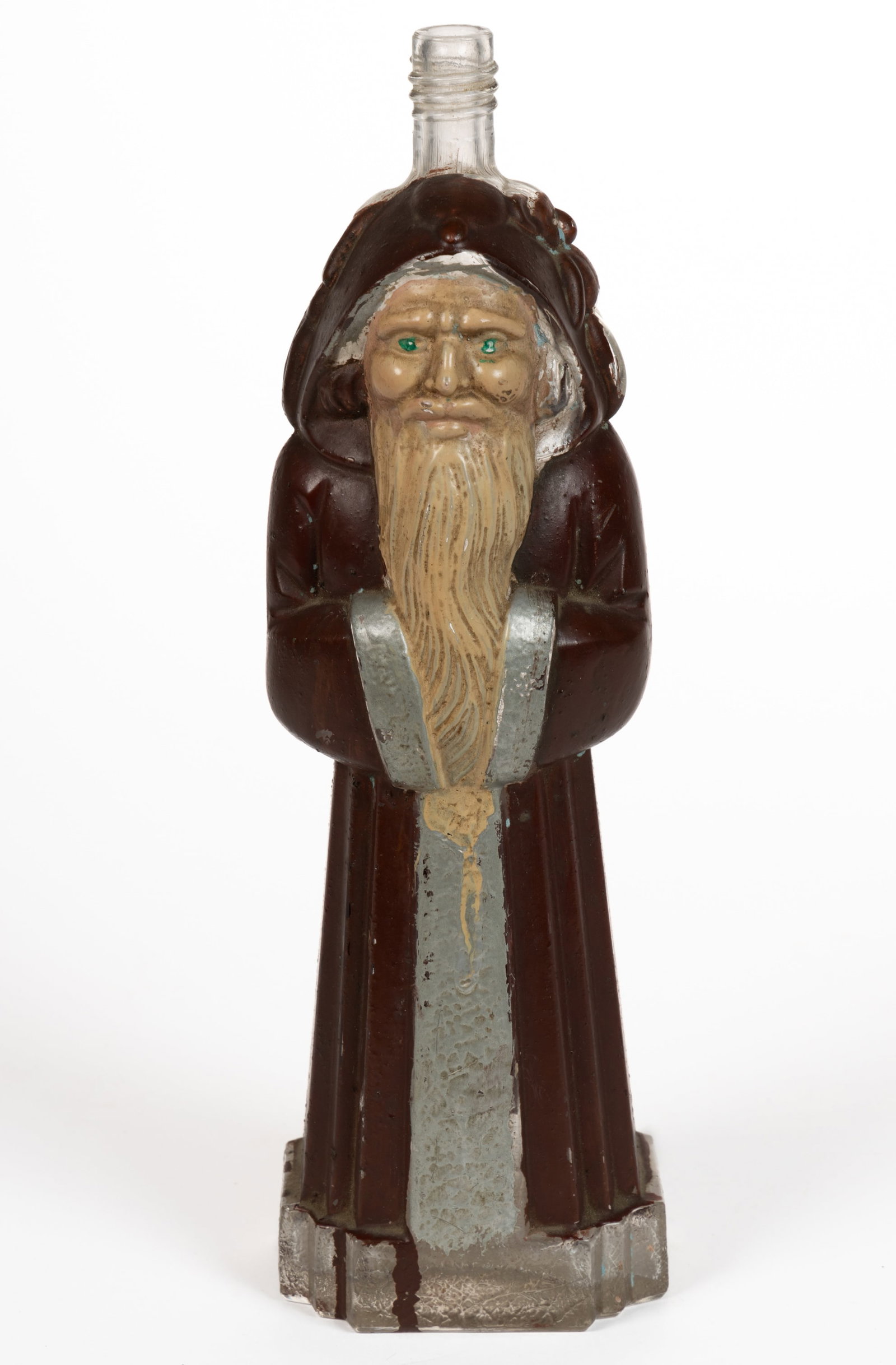 SANTA CLAUS PAINTED GLASS FIGURAL BOTTLE: SANTA CLAUS PAINTED GLASS FIGURAL BOTTLE, standing thin figure with full-length maroon robe, unpainted basket of toys on his back, screw top, unmarked. Retains original painted surface. Circa 1920. 11