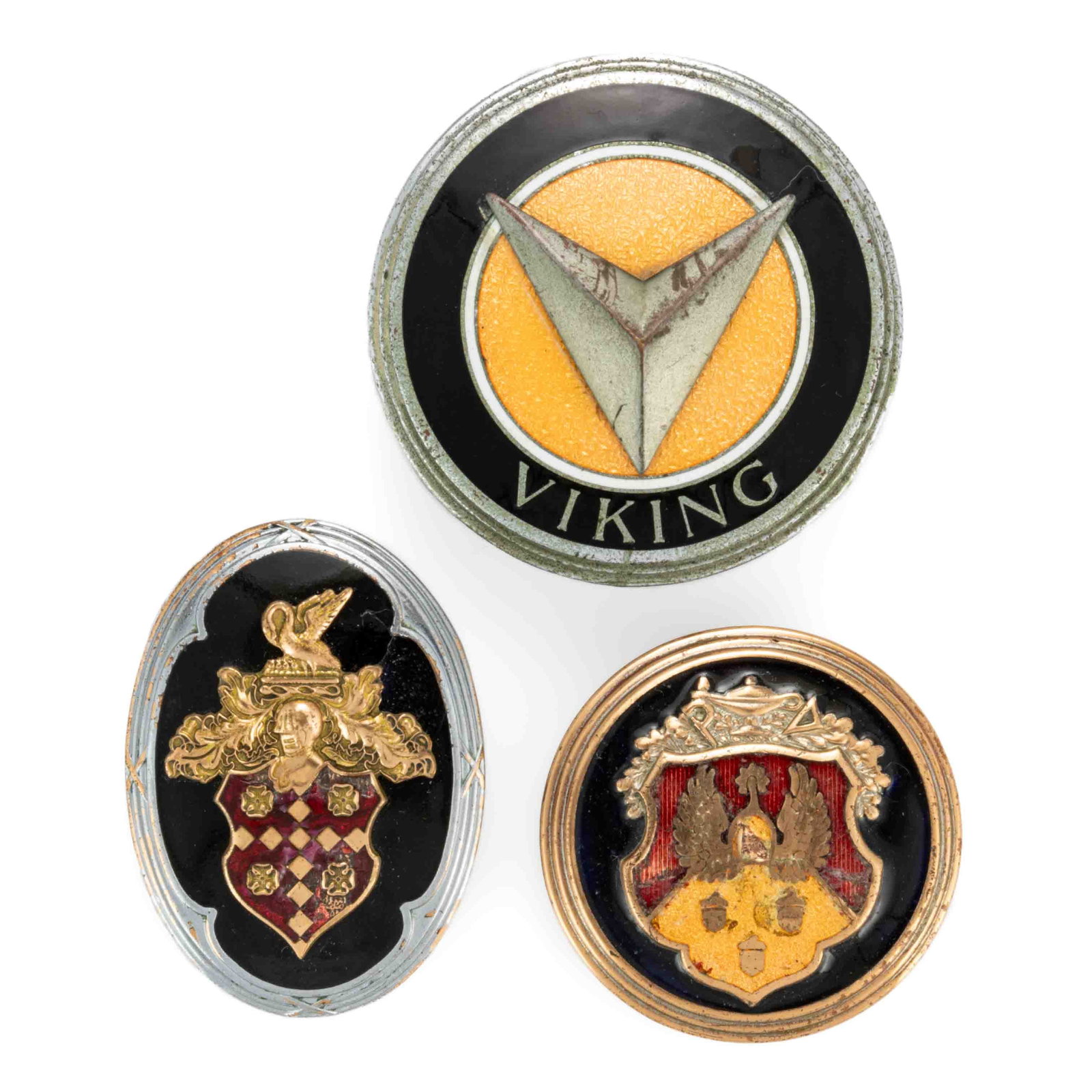 ASSORTED MANUFACTURERS AUTOMOBILE / CAR / VEHICLE RADIATOR EMBLEMS, LOT OF THREE: ASSORTED MANUFACTURERS AUTOMOBILE / CAR / VEHICLE RADIATOR EMBLEMS, LOT OF THREE, comprising two Olds Motor Works examples, including a Viking with reverse fitted with a threaded post a