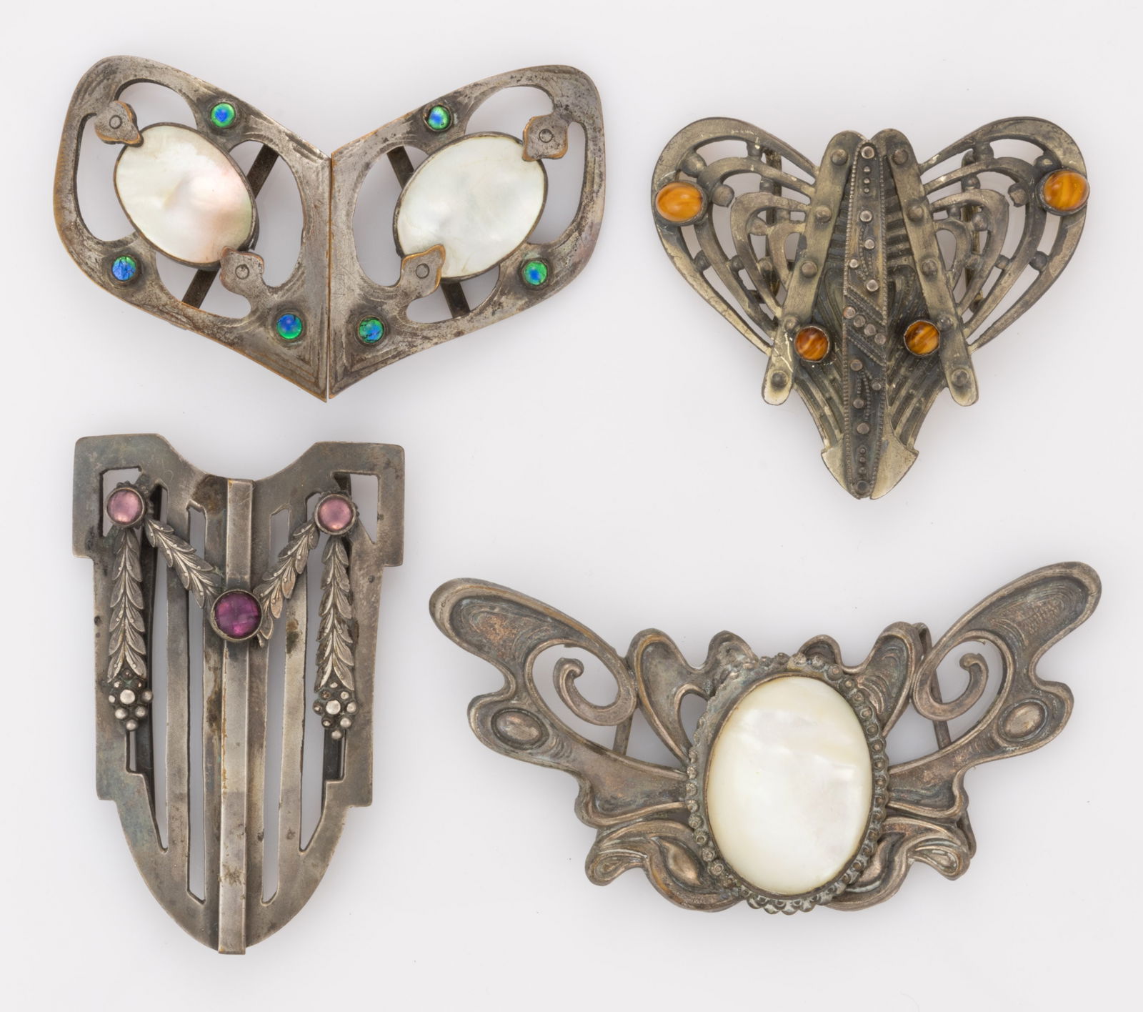 ANTIQUE ARTS AND CRAFTS AND OTHER SILVER-TONED METAL BELT OR DRESS BUCKLES, LOT OF FOUR (1 of 3)