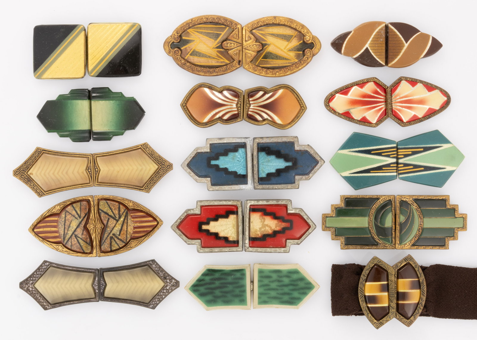 ANTIQUE / VINTAGE CZECHOSLOVAKIAN AND OTHER ART DECO CELLULOID-FRONT BELT OR DRESS BUCKLES, LOT OF: ANTIQUE / VINTAGE CZECHOSLOVAKIAN AND OTHER ART DECO CELLULOID-FRONT BELT OR DRESS BUCKLES, LOT OF 15, each two-part form having metal backing and celluloid front, including several with guilloche-typ