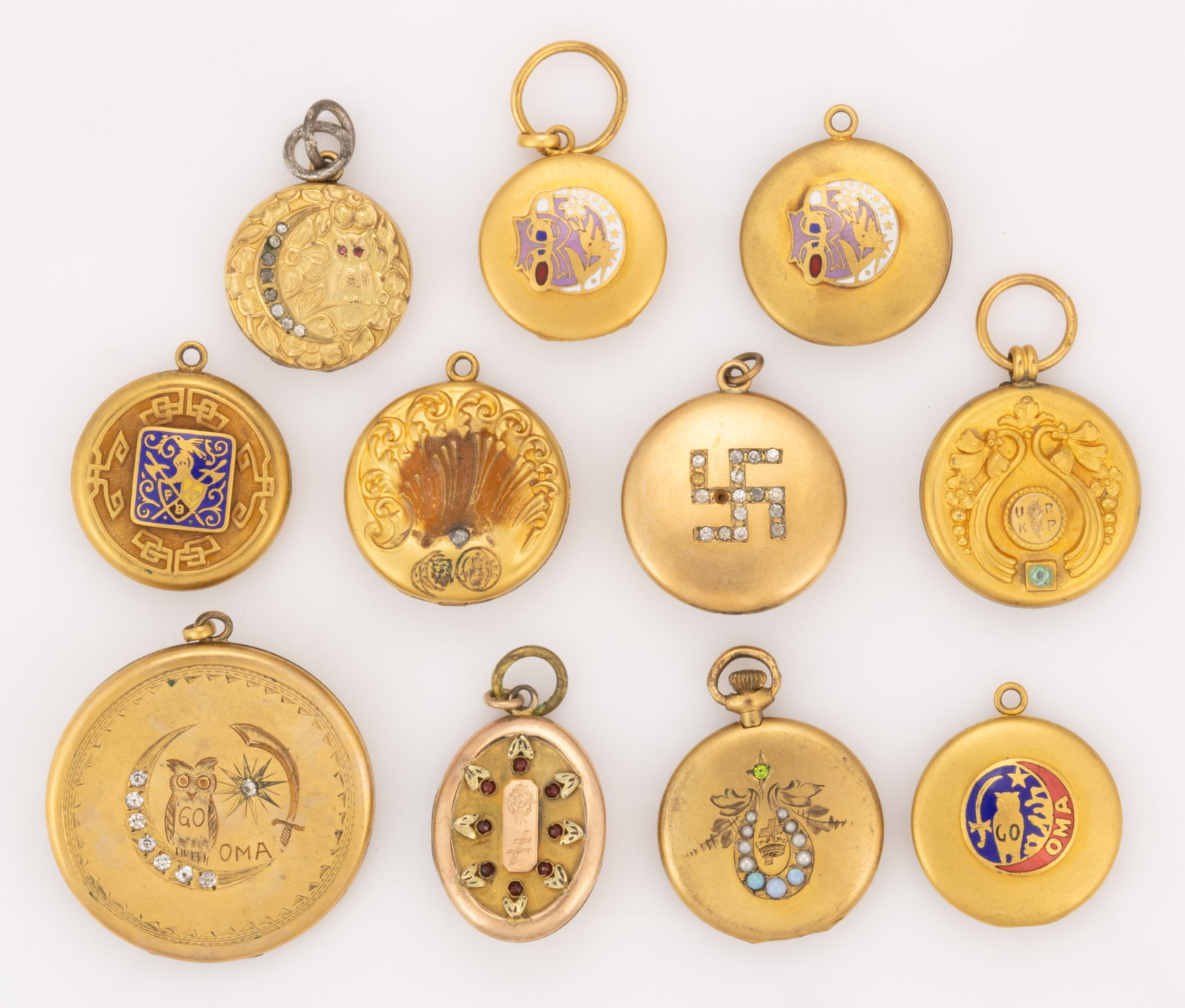 ANTIQUE / VINTAGE KNIGHTS OF PYTHIAS AND OTHER FRATERNAL LOCKETS / WATCH FOBS, LOT OF 11: ANTIQUE / VINTAGE KNIGHTS OF PYTHIAS AND OTHER FRATERNAL LOCKETS / WATCH FOBS, LOT OF 11, each piece gold-filled/toned having one or more applied emblems to one or both sides with many having ena