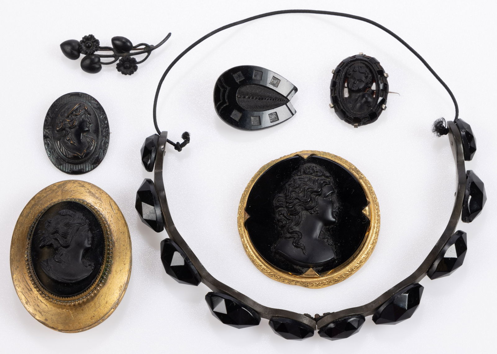 ANTIQUE AND VINTAGE FRENCH JET / BLACK GLASS AND OTHER JEWELRY, LOT OF SEVEN: ANTIQUE AND VINTAGE FRENCH JET / BLACK GLASS AND OTHER JEWELRY, LOT OF SEVEN, comprising a Victorian headband made of two hinged vulcanite sections set with graduated faceted French jet beads and a pr