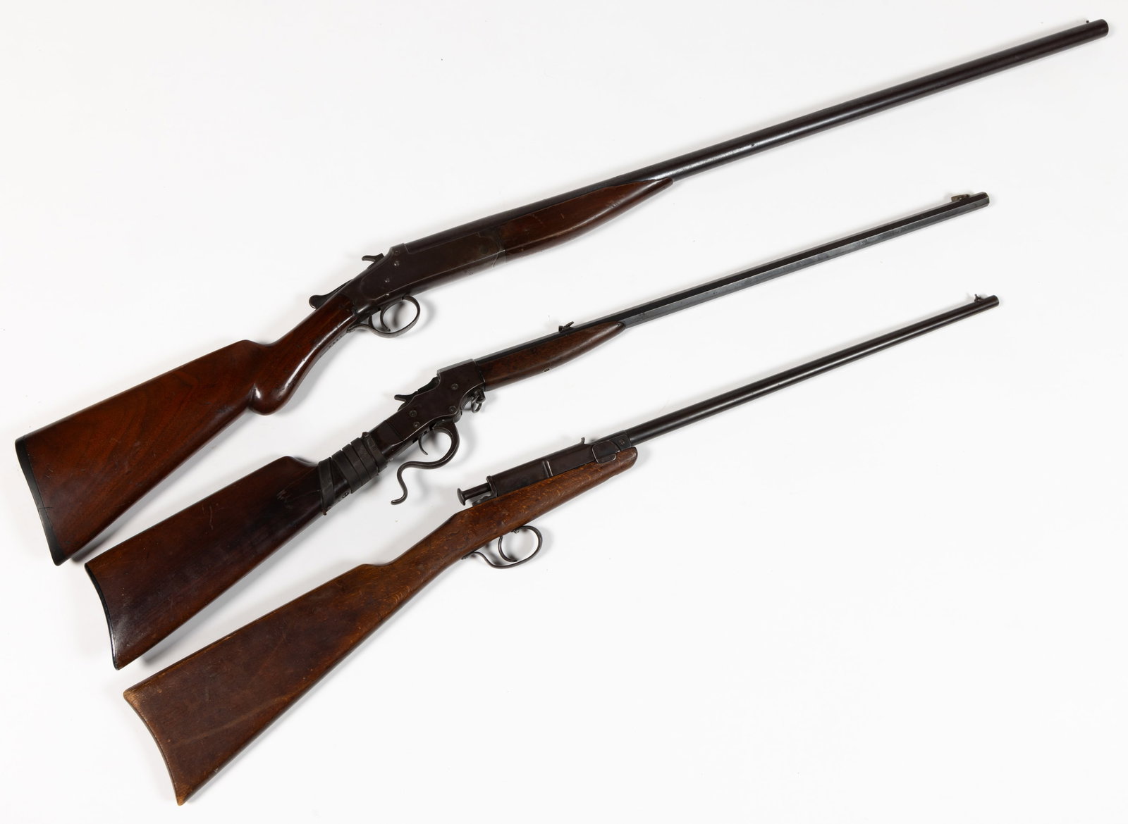 ASSORTED FIREARMS, LOT OF THREE: ASSORTED FIREARMS, LOT OF THREE, (1) Iver Johnson Champion 12 ga. shotgun, serial #4488; (2) Stevens Favorite 22 LR cal. lever-action boy's rifle; and (3) German Deutsch Mod. 1 22 LR cal. tip-up b