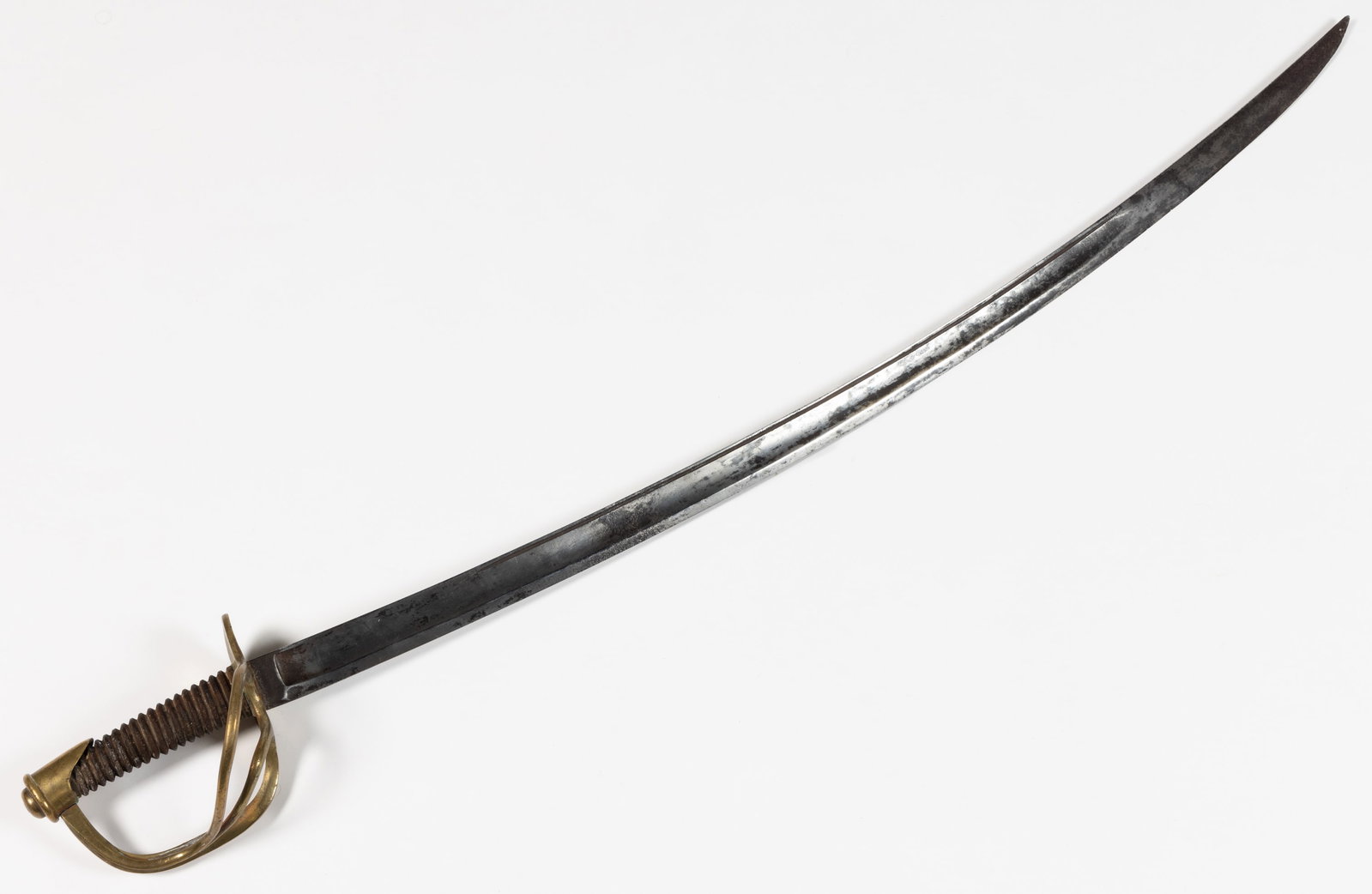 CIVIL WAR UNMARKED US MODEL 1860 CAVALRY OFFICER'S SABER WITH OWNER'S NAME: CIVIL WAR UNMARKED US MODEL 1860 CAVALRY OFFICER'S SABER WITH OWNER'S NAME, curved blade with unstopped fuller that runs open to within 3/4″ of the guard and 9 1/4″ of the tip