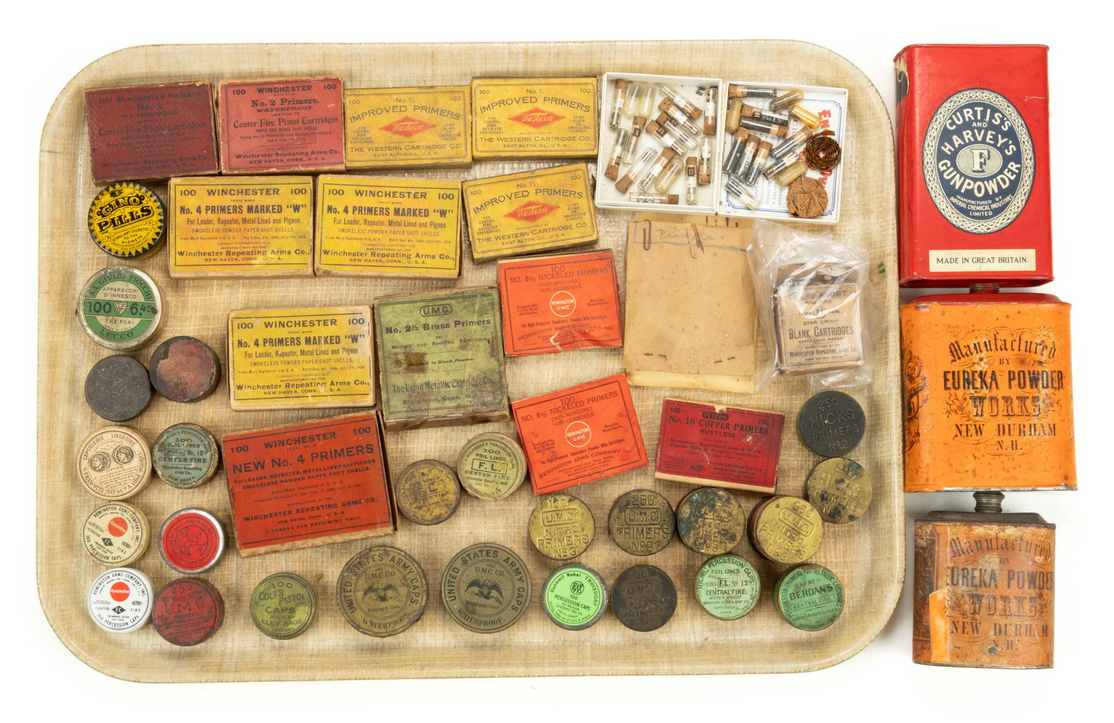 ANTIQUE / VINTAGE FIREARMS ACCOUTREMENTS, UNCOUNTED LOT: ANTIQUE / VINTAGE FIREARMS ACCOUTREMENTS, UNCOUNTED LOT, Winchester, Remington/UMC, Peters, and others, including gunpowder tins, cardboard boxes of primers, tins of primers and percussion caps, etc. 