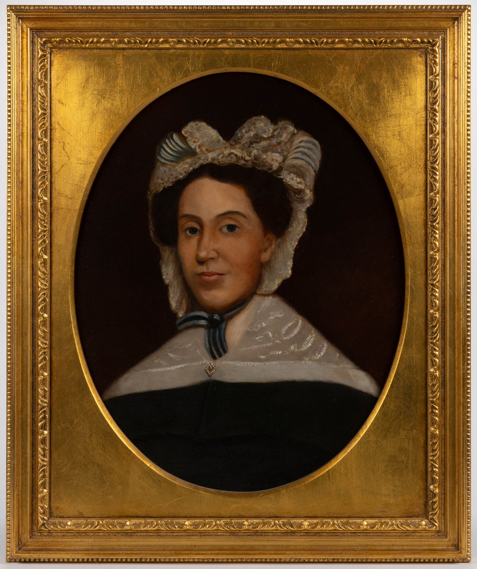 AMERICAN SCHOOL (19TH CENTURY) PORTRAIT OF A LADY: AMERICAN SCHOOL (19TH CENTURY) PORTRAIT OF A LADY, oil on canvas, a lady wearing a fashionable lace and blue ribbon cap and dark green dress with lace shoulder cover and pearl brooch, no signature loc