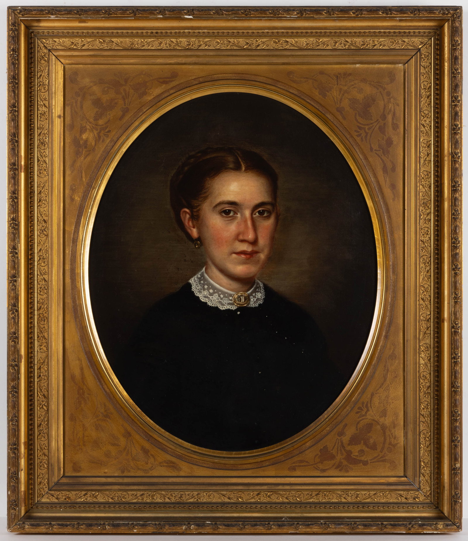 AMERICAN SCHOOL (19TH CENTURY) PORTRAIT OF A LADY: AMERICAN SCHOOL (19TH CENTURY) PORTRAIT OF A LADY, oil on canvas, bust-length depiction of sitter wear a dress with white lace and a brooch, no signature located. Housed in a period gilt molded frame.