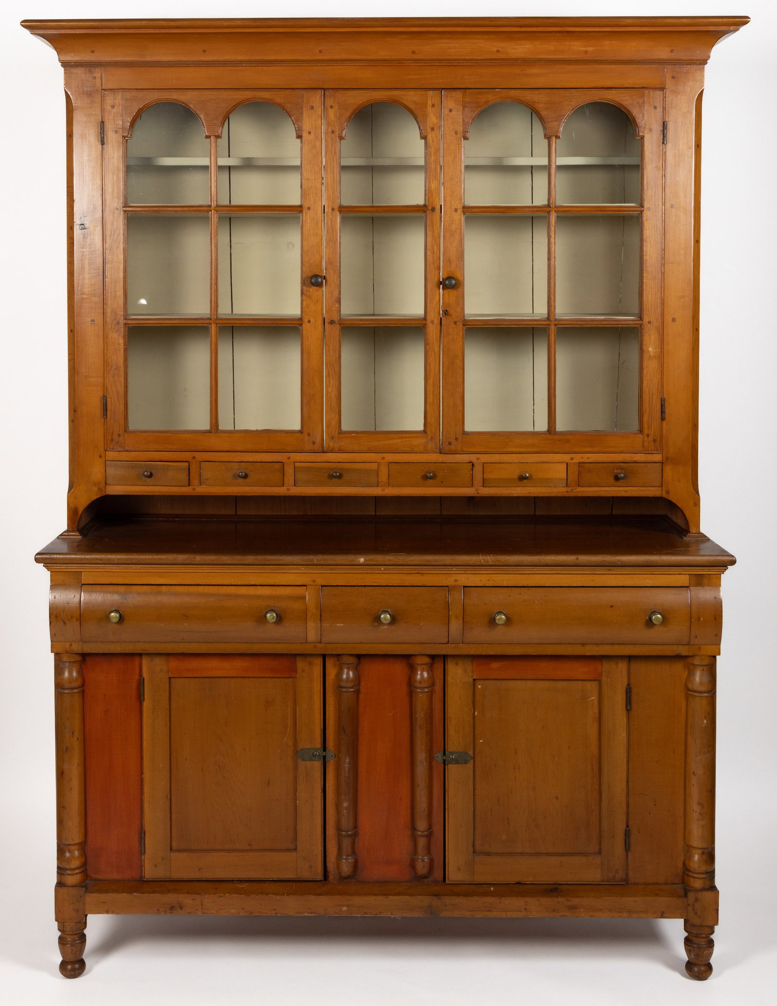 PENNSYLVANIA POPLAR STEPBACK DUTCH CUPBOARD: PENNSYLVANIA POPLAR STEPBACK DUTCH CUPBOARD. two-piece construction, the upper section with applied ogee-molded cornice over two hinged twelve light doors, concealing two fixed shelves with plate groo