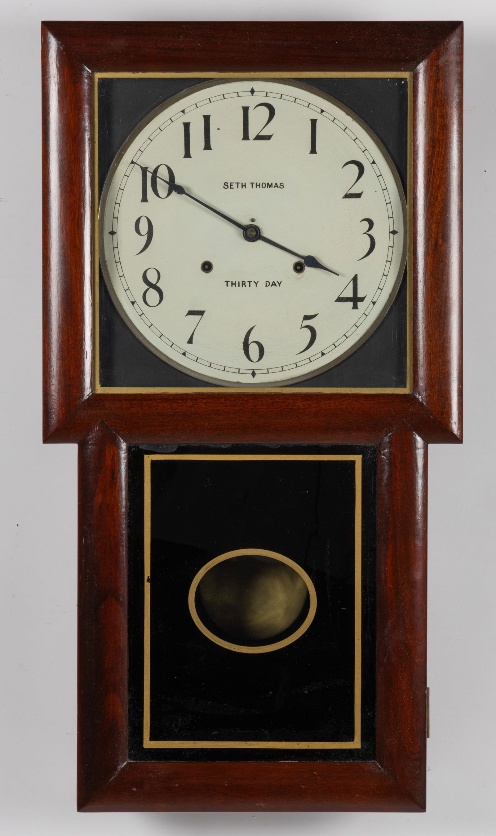SETH THOMAS "LITCHFIELD" 30-DAY WALL CLOCK: SETH THOMAS "LITCHFIELD" 30-DAY WALL CLOCK, mahogany case, brass double-spring time-only movement, painted dial, original pendulum with brass bob, original glass. Circa 1909. 31 1/2" HO