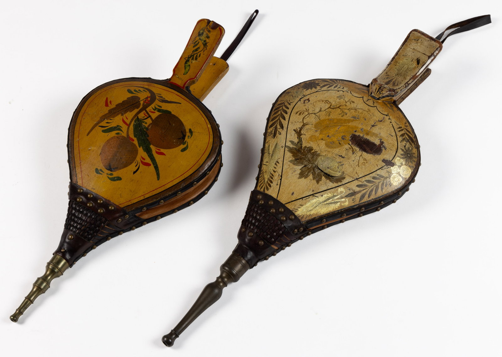 AMERICAN PAINT-DECORATED BELLOWS, LOT OF TWO: AMERICAN PAINT-DECORATED BELLOWS, LOT OF TWO, wood, brass, and leather, each retains original polychrome painted surface, including one with stenciled bird design. Probably New England. 19th century. 