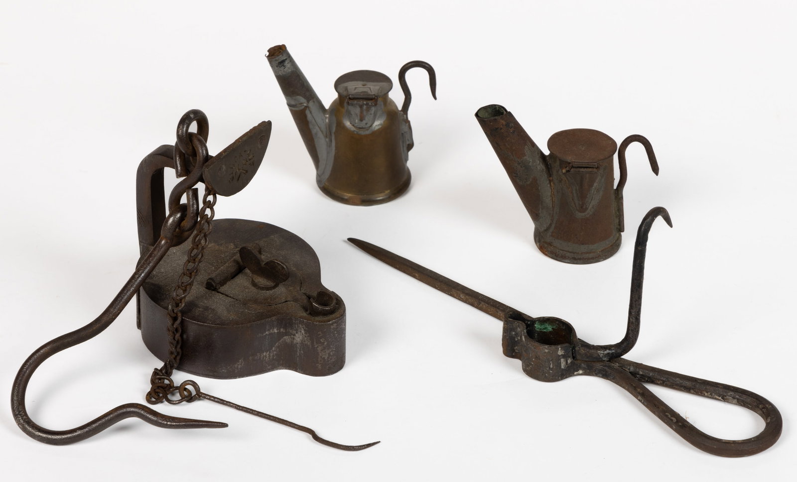 ASSORTED METAL MINING AND RELATED LIGHTING ARTICLES, LOT OF FOUR: ASSORTED METAL MINING AND RELATED LIGHTING ARTICLES, LOT OF FOUR, comprising two cap lamps, including a brass J. Anton & Son and a sheet-iron example; an iron German frog lamp in an ovoid form,&nb