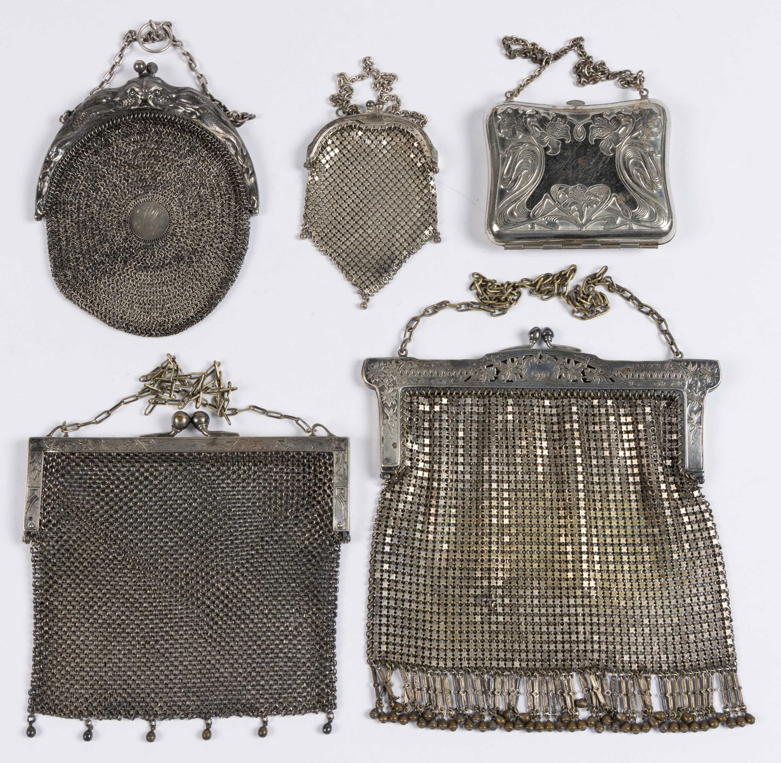 ANTIQUE / VINTAGE STERLING AND SILVER-PLATED / SILVER-TONED MESH AND OTHER LADY'S PURSES, LOT OF: ANTIQUE / VINTAGE STERLING AND SILVER-PLATED / SILVER-TONED MESH AND OTHER LADY'S PURSES, LOT OF FIVE, each with original chain strap, comprising a marked sterling round mesh purse having a dolphi