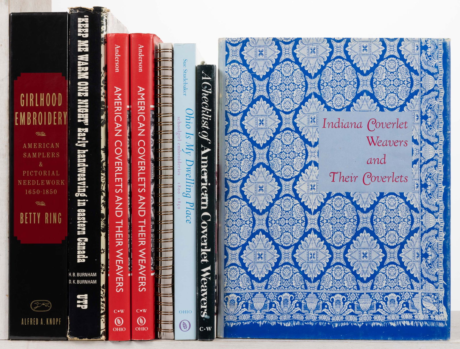 ASSORTED COVERLETS AND SAMPLERS REFERENCE VOLUMES, LOT OF 11: ASSORTED COVERLETS AND SAMPLERS REFERENCE VOLUMES, LOT OF 11, including Walter, Stay At Home and Use Me Well, Flax & Fleece: Fiber to Fabric, Bedford, PA: National Museum of the American Cove
