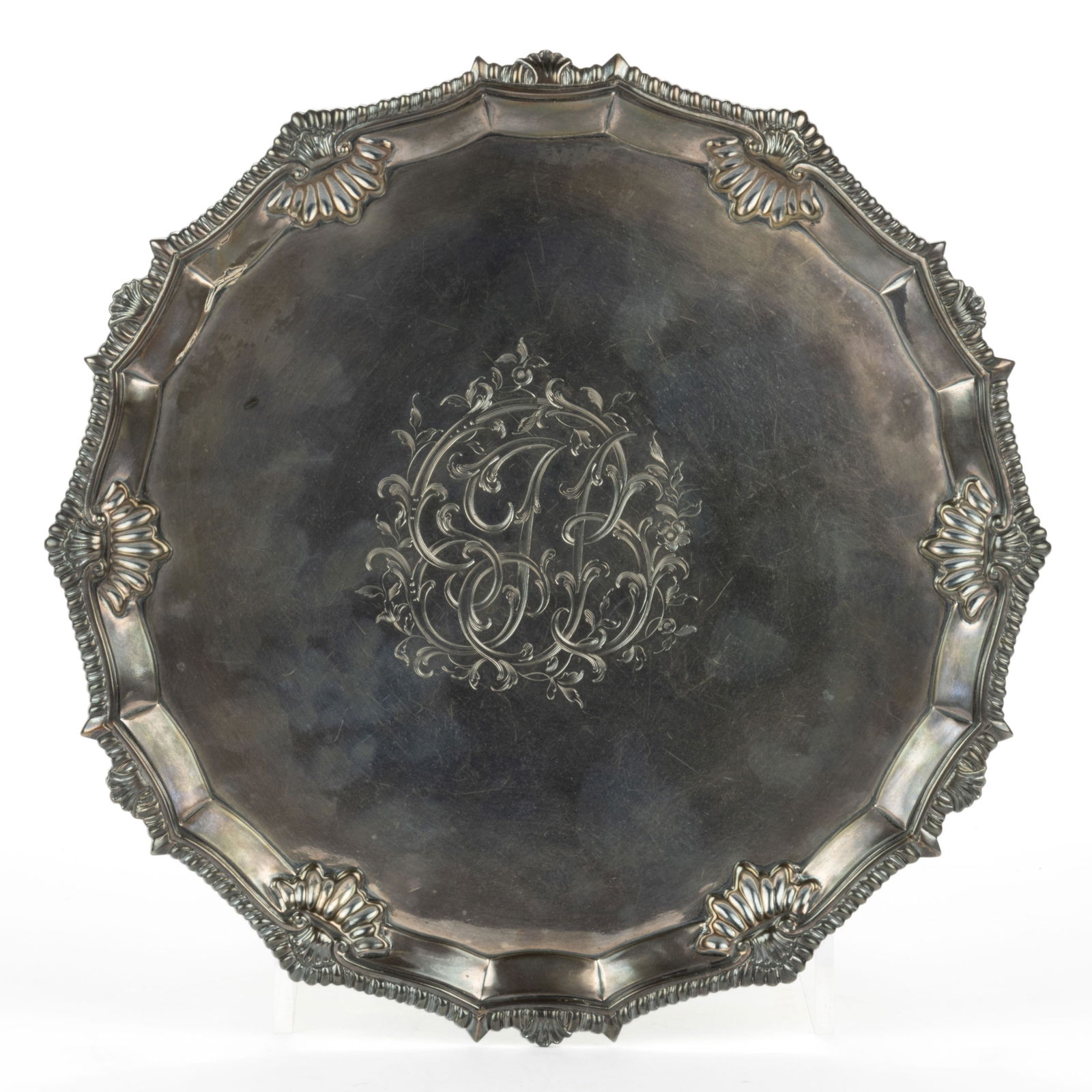 RICHARD RUGG I, ATTRIBUTED, ENGLISH GEORGIAN STERLING SILVER SALVER: RICHARD RUGG I, ATTRIBUTED, ENGLISH GEORGIAN STERLING SILVER SALVER, having a round well with an 18-sided rim having gadroon and shell border, center with ornate engraved "JB" initials featu