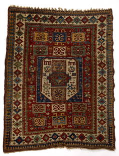 ANTIQUE CAUCASIAN SCATTER RUG: ANTIQUE CAUCASIAN SCATTER RUG, featuring a large white hexagon flanked at each end by six squares with clearly defined border in stepped polygons. Late 19th/early 20th century. 4' 10 1/2" x 6