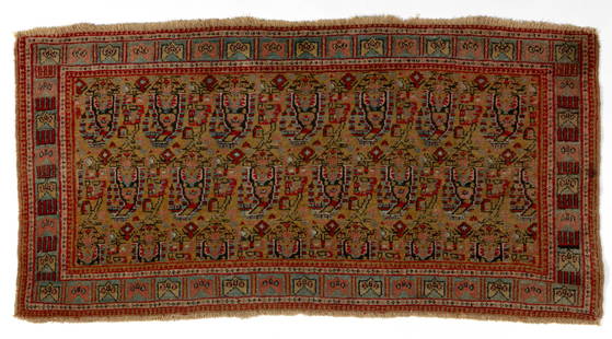 ANTIQUE PERSIAN SCATTER RUG: ANTIQUE PERSIAN SCATTER RUG, featuring field filled with boteh motifs placed in orderly rows surrounded by main row of stylized geometric designs. Late 19th/early 20th century. 19"