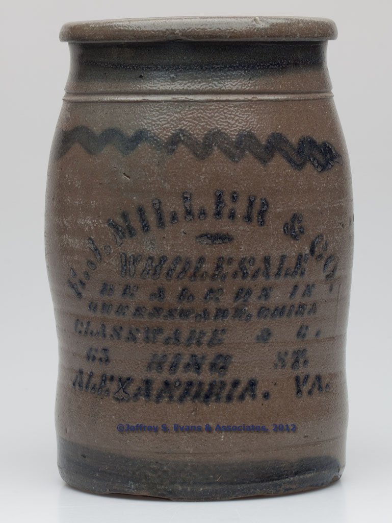 VIRGINIA MERCHANT'S STENCILED STONEWARE JAR: VIRGINIA MERCHANT'S STENCILED STONEWARE JAR, salt glazed, approximately 1 gallon capacity, cobalt "E. J. MILLER & CO. / WHOLESALE / DEALERS IN / QUEENSWARE, CHINA / GLASSWARE & C. / 65 KING ST. / ALEX