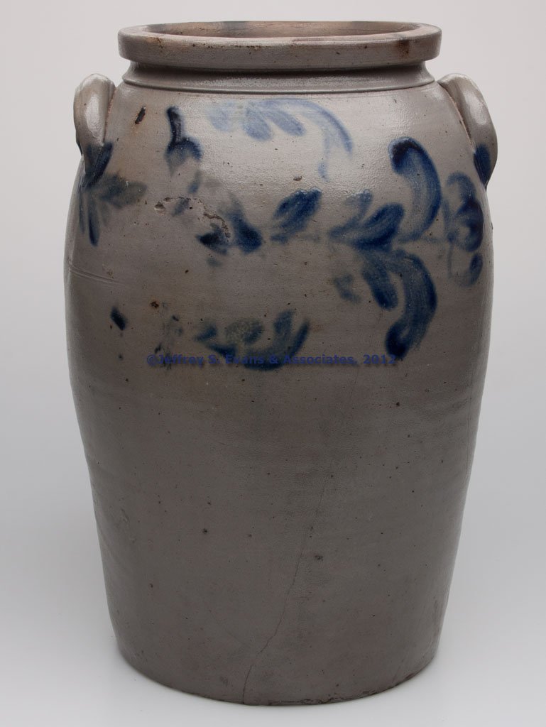 BALTIMORE, MARYLAND DECORATED STONEWARE LARGE JAR: BALTIMORE, MARYLAND DECORATED STONEWARE LARGE JAR, salt glazed, "6" gallon capacity stamp, elongated ovoid form with a heavy squared rim and applied arched handles. Brushed cobalt horizontal floral de