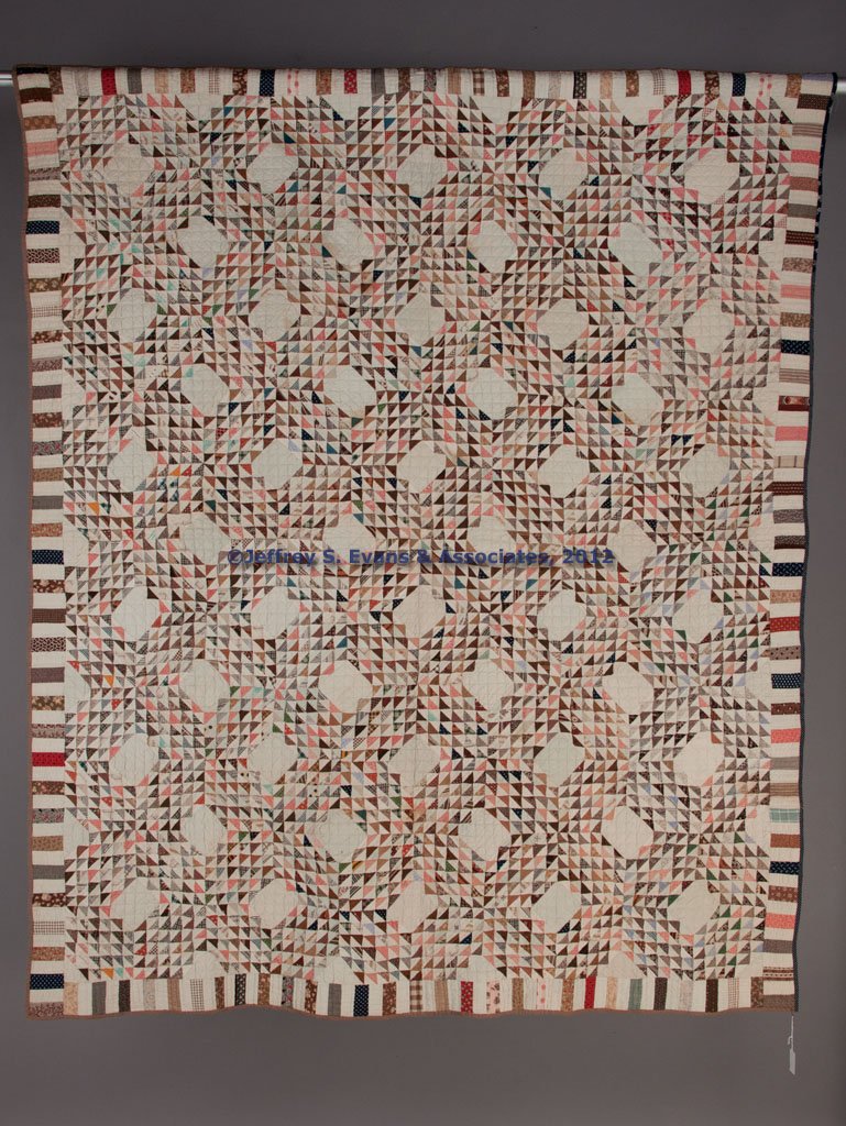 SHENANDOAH VALLEY OF VIRGINIA OCEAN WAVES PATTERN : SHENANDOAH VALLEY OF VIRGINIA OCEAN WAVES PATTERN PIECED QUILT, using 1" triangles set with unpieced blocks, striped border, and straight-line hand quilting. Second half 19th century. 65" x 80". Prove