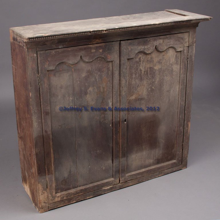 SHENANDOAH VALLEY OF VIRGINIA FEDERAL WALNUT PRESS: SHENANDOAH VALLEY OF VIRGINIA FEDERAL WALNUT PRESS TOP, dovetailed case, bold cove-molded cornice with dental edging, above two serpentine-top paneled doors concealing three fixed shelves. Yellow pine