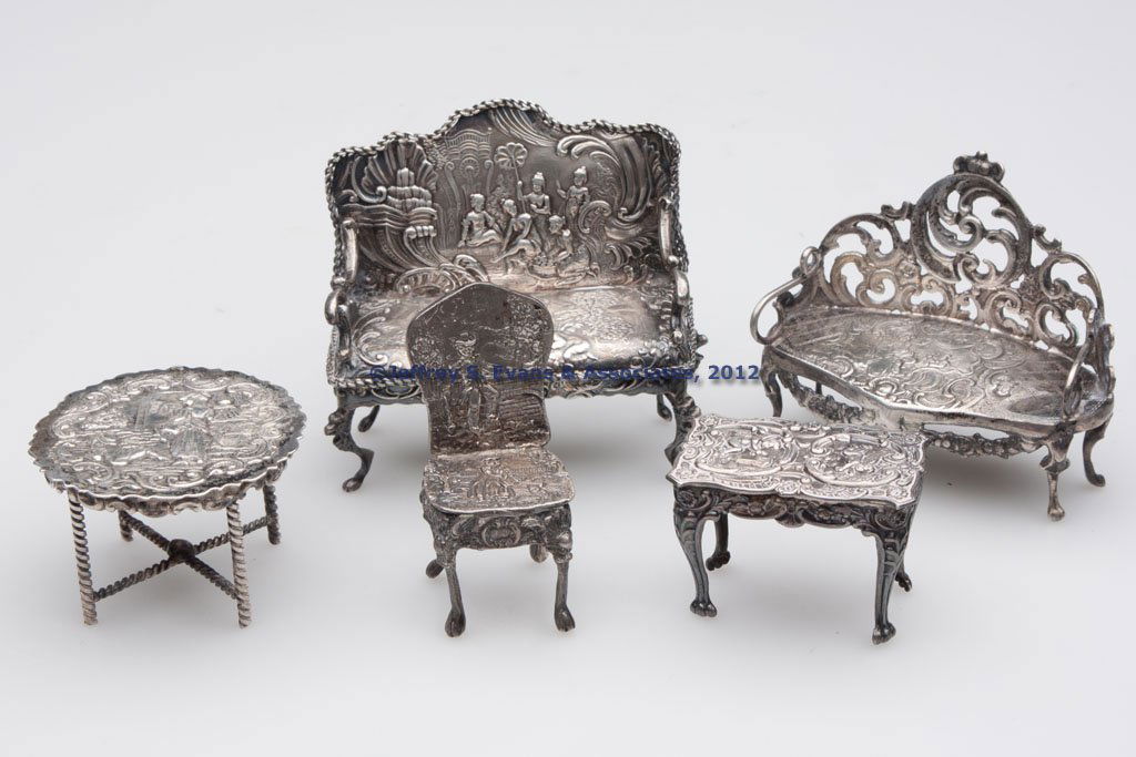 CONTINENTAL SILVER MINIATURE FURNITURE, LOT OF FIV: CONTINENTAL SILVER MINIATURE FURNITURE, LOT OF FIVE, comprising two settees, two tables, and a side chair, each with repousse decoration, one without hallmarks, others bearing hallmark and/or 925 mark