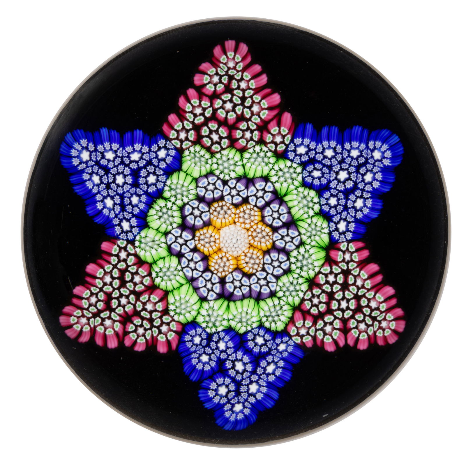 JOHN DEACONS (SCOTTISH, B. 1950) STAR MILLEFIORI STUDIO ART GLASS PAPERWEIGHT: JOHN DEACONS (SCOTTISH, B. 1950) STAR MILLEFIORI STUDIO ART GLASS PAPERWEIGHT, central white stardust cane surrounded by an interior garland of yellow stardust canes, second band having purple and whi