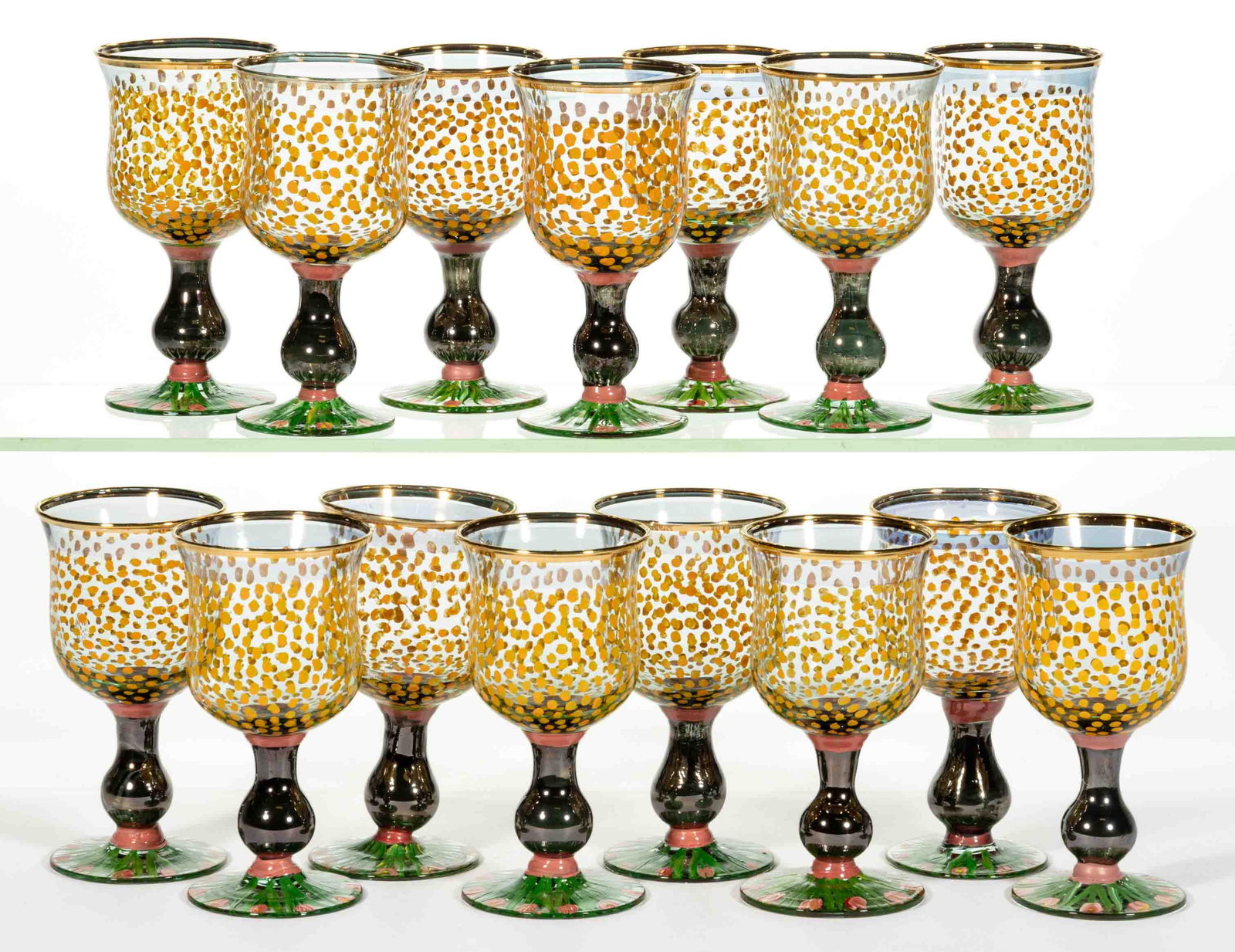 MACKENZIE-CHILDS ENAMELED GLASS WINE GLASSES, SET OF 15: MACKENZIE-CHILDS ENAMELED GLASS WINE GLASSES, SET OF 15, each colorless with polychrome-enamel polka dot bowl and floral foot, marked to underside including "Victorian and Richard" and 
