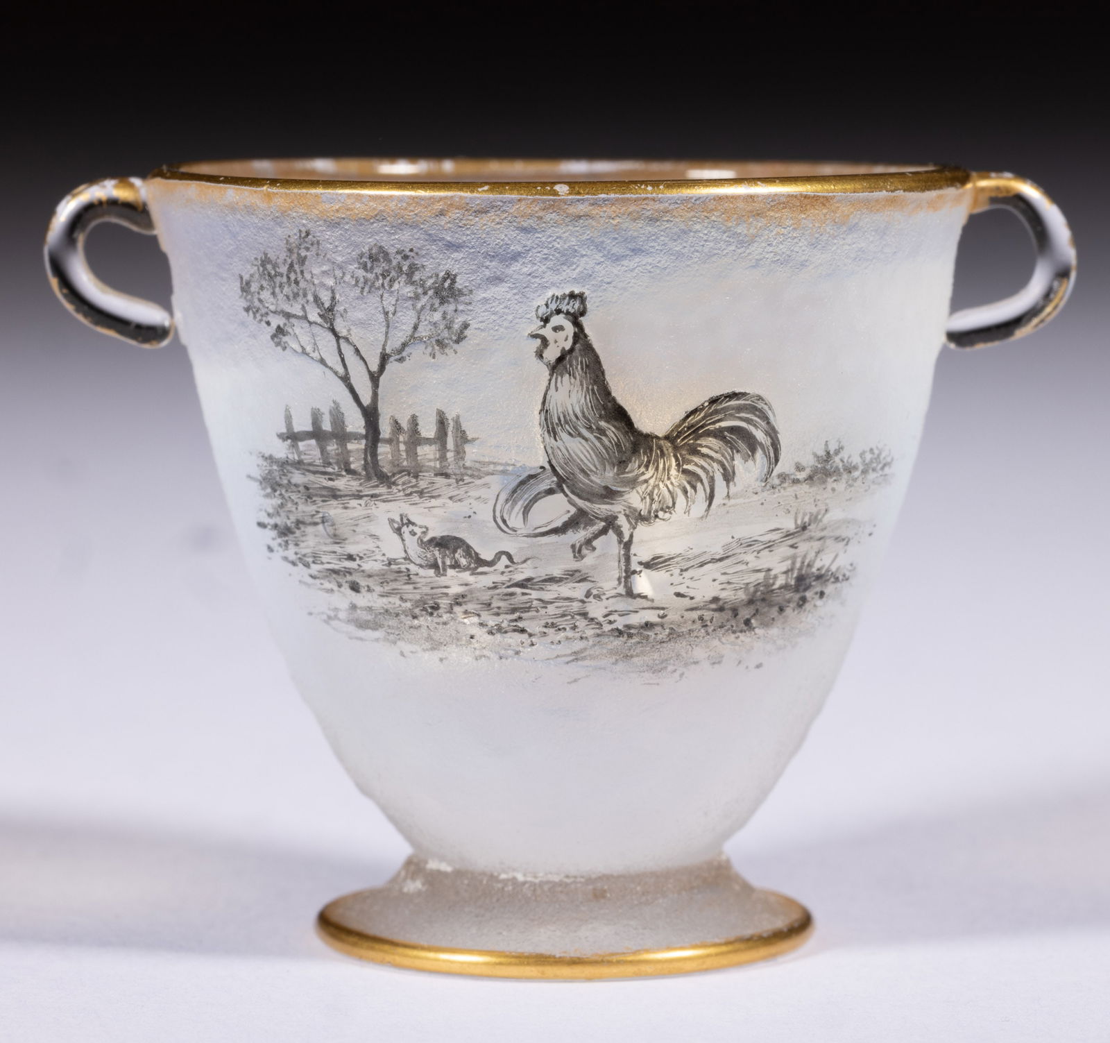 DAUM ROOSTER ENAMEL-DECORATED OPALESCENT OPEN SALT / EGG CUP: DAUM ROOSTER ENAMEL-DECORATED OPALESCENT OPEN SALT / EGG CUP, fiery opalescent with polychrome-enamel decoration, conical form with two applied handles, one side featuring two blooming flowers and a b