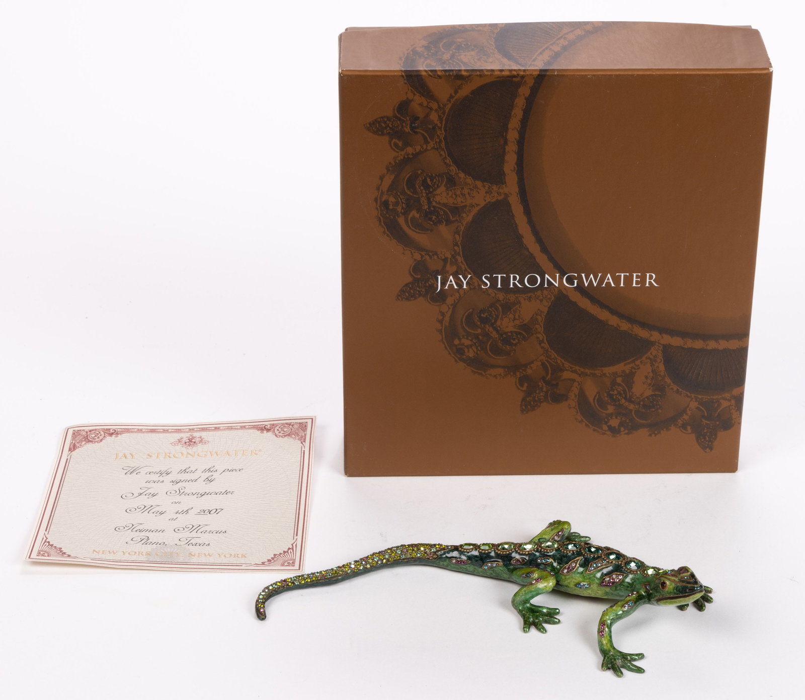 JAY STRONGWATER SIGNED ENAMEL AND SWAROVSKI CRYSTAL SALAMANDER FIGURE: JAY STRONGWATER SIGNED ENAMEL AND SWAROVSKI CRYSTAL SALAMANDER FIGURE, green enamel with multicolor rhinestones, signed in marker to the underside, with original box, bag, and certificate certifying t