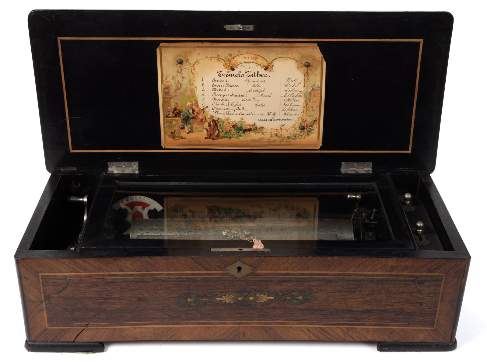 SWISS 10-AIRS LEVER-WIND CYLINDER MUSIC BOX: SWISS 10-AIRS LEVER-WIND CYLINDER MUSIC BOX, 11" cylinder, floral inlaid rosewood and ebonized case, original lithographed tune card attached to the underside of the lid with a hand-written 