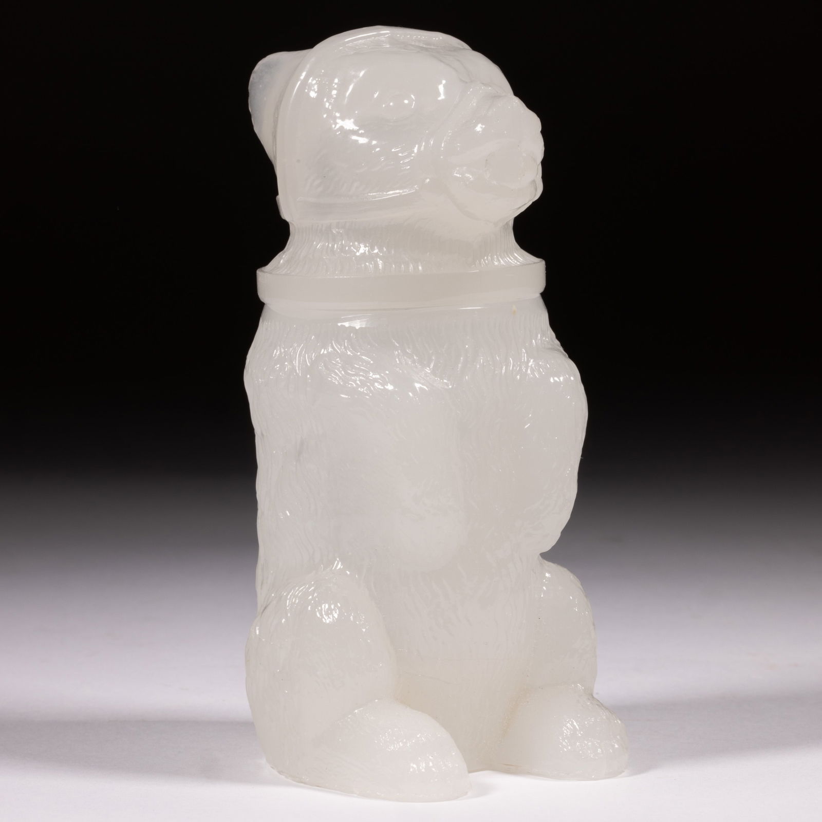 PRESSED MUZZLED BEAR LARGE-SIZE JAR: PRESSED MUZZLED BEAR LARGE-SIZE JAR, alabaster/clambroth, embossed "J. HAUEL & Co / PHILA." under the base. Boston & Sandwich Glass Co. 1850-1870. 4 1/2" HOA, 1 7/8" D