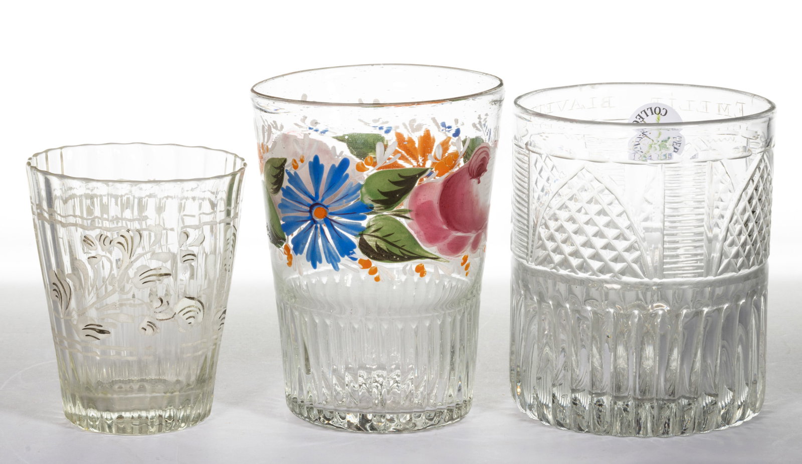 ASSORTED BOHEMIAN GLASS TUMBLERS, LOT OF THREE: ASSORTED BOHEMIAN GLASS TUMBLERS, LOT OF THREE, colorless, comprising a Gothic Arch cut and dip-molded example dated for "1835", one having polychrome-enamel floral decoration, and ta patter