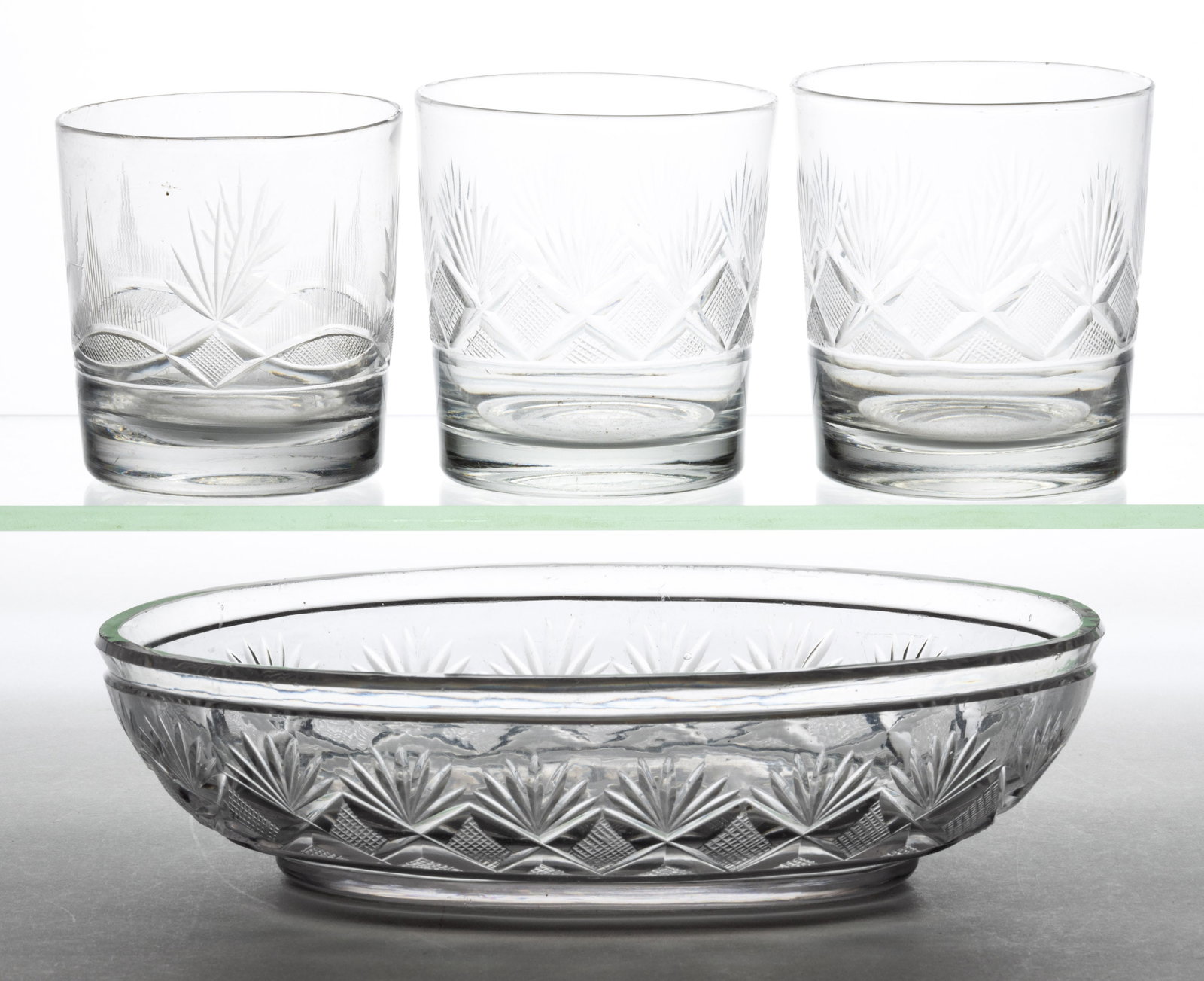ASSORTED CUT STRAWBERRY DIAMONDS AND FANS ARTICLES, LOT OF FOUR: ASSORTED CUT STRAWBERRY DIAMONDS AND FANS ARTICLES, LOT OF FOUR, comprising a pair of tumblers, an oval-shaped bowl, and another tumbler having the addition of flashed vesicas to the cut pattern.