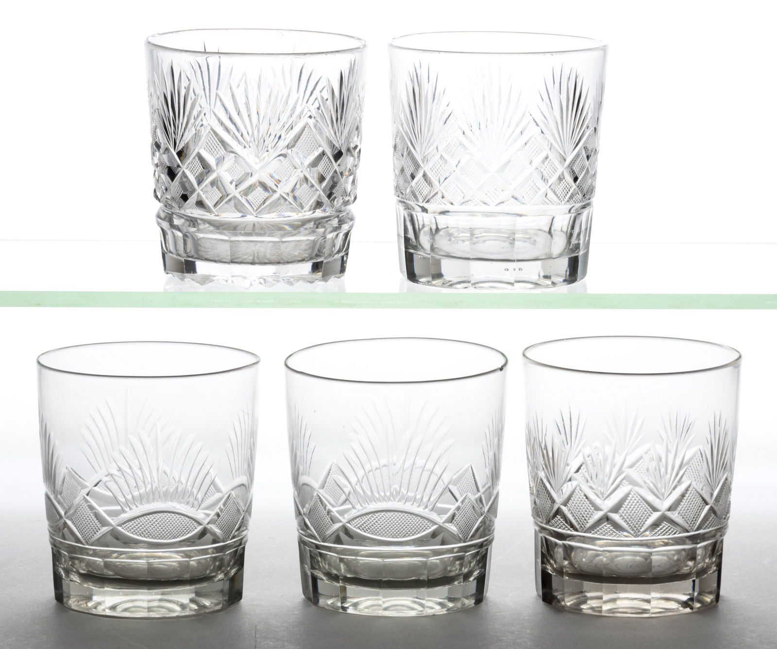 ASSORTED BLOWN AND CUT GLASS TUMBLERS, LOT OF FIVE: ASSORTED BLOWN AND CUT GLASS TUMBLERS, LOT OF FIVE, three with cut strawberry diamonds and fans patterns of varying complexity, two with strawberry diamonds and sheaves above vesicas, e