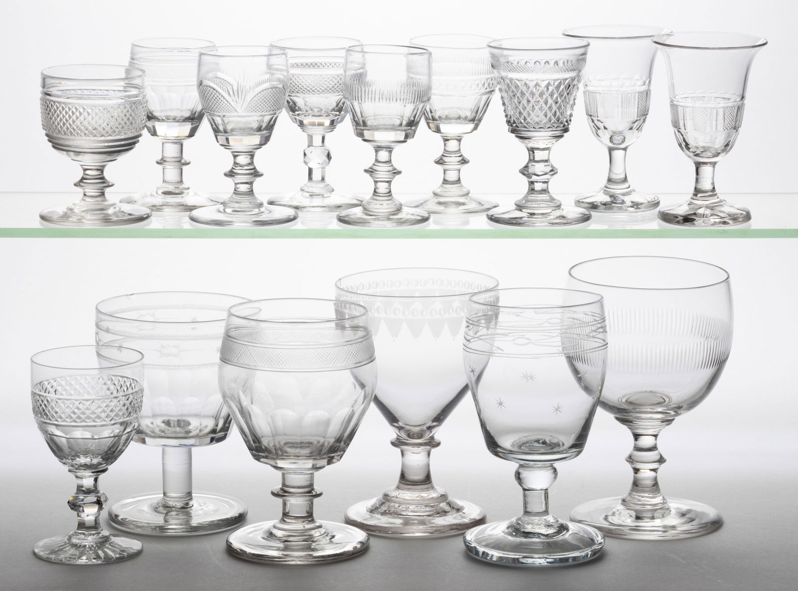 ASSORTED CUT AND ENGRAVED GLASS DRINKING ARTICLES, LOT OF 15: ASSORTED CUT AND ENGRAVED GLASS DRINKING ARTICLES, LOT OF 15, colorless, including seven wines, an engraved rummer, and four goblets. Various makers. 19th century. 3 1/2" to 5 3/4" H. 