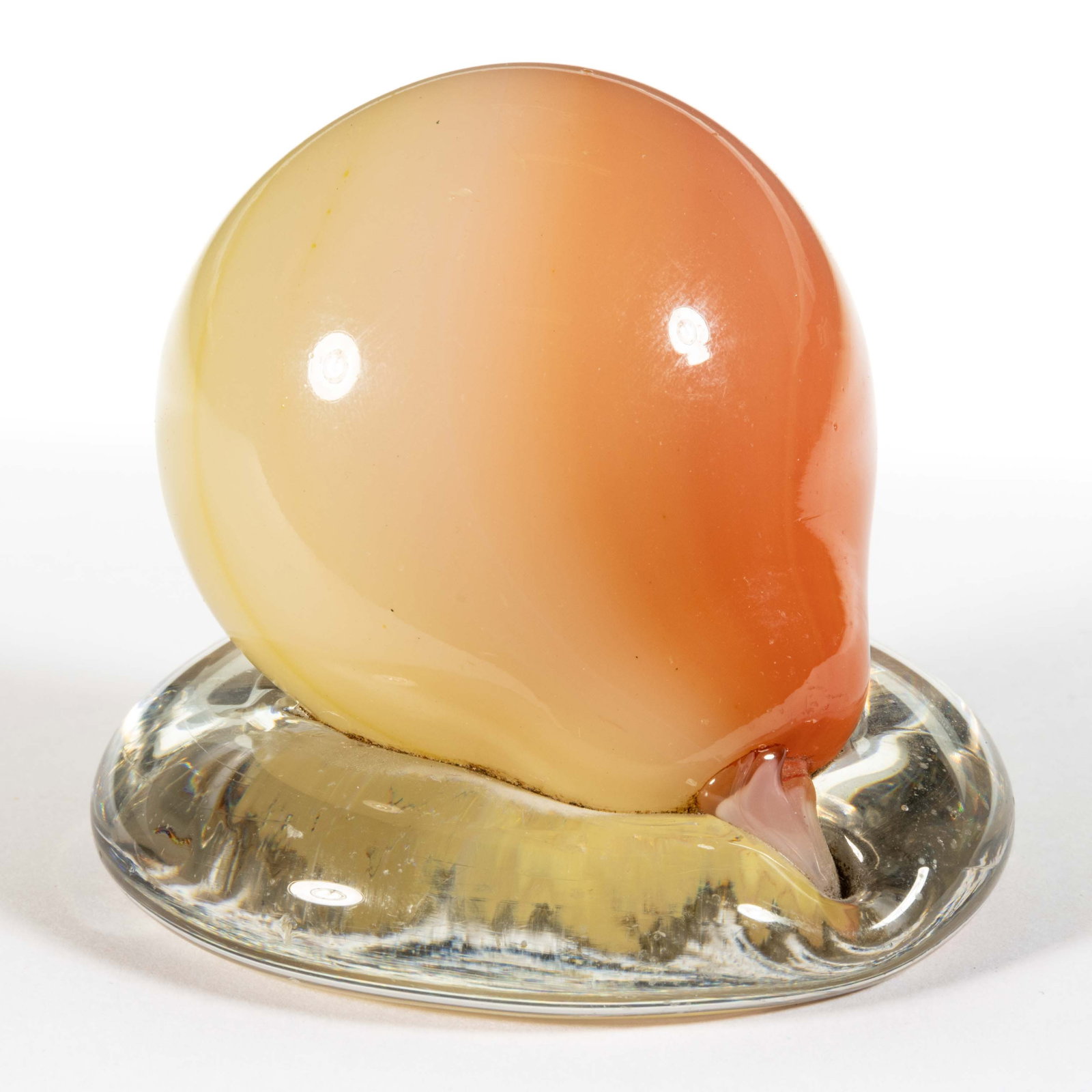 ANTIQUE NEW ENGLAND BLOWN PEAR-FORM PAPERWEIGHT: ANTIQUE NEW ENGLAND BLOWN PEAR-FORM PAPERWEIGHT, cased rose to yellow, large size, green button-like rough pontil to end, raised on a colorless circular base. New England Glass Co. 1860-1880. 2 1/2&qu
