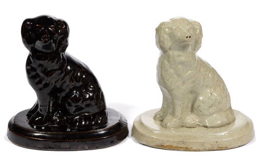 GALESBURG, ILLINOIS STONEWARE FIGURAL DOG / SPANIEL DOORSTOPS, LOT OF TWO: GALESBURG, ILLINOIS STONEWARE FIGURAL DOG / SPANIEL DOORSTOPS, LOT OF TWO, each featuring left-facing Staffordshire-style spaniels sitting on two-tier oval pedestal bases with well-defi