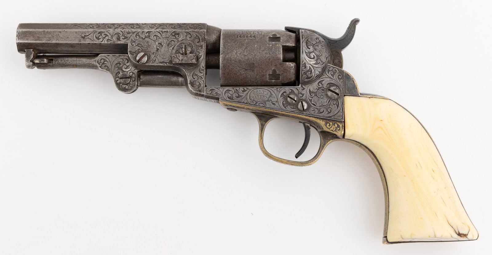 COLT MODEL 1849 POCKET REVOLVER WITH FACTORY ENGRAVING BY GUSTAVE YOUNG: COLT MODEL 1849 POCKET REVOLVER WITH FACTORY ENGRAVING BY GUSTAVE YOUNG, 31 caliber percussion, five-shot cylinder, 4" octagonal barrel, silver-plated brass trigger guard, and backstrap with