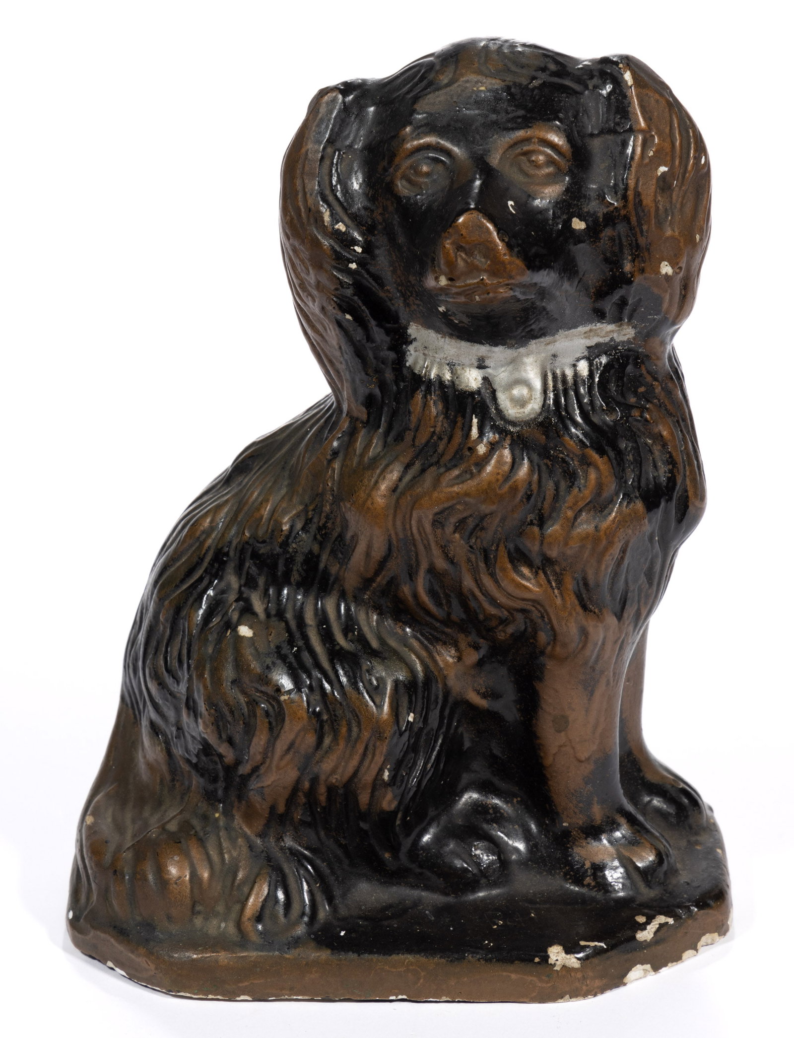 AMERICAN CHALKWARE PAINTED DOG / SPANIEL FIGURE: AMERICAN CHALKWARE PAINTED DOG / SPANIEL FIGURE, hollow-body slip-cast form seated on a thin octagonal base, well-detailed right facing spaniel with deeply molded fur and locket, retain