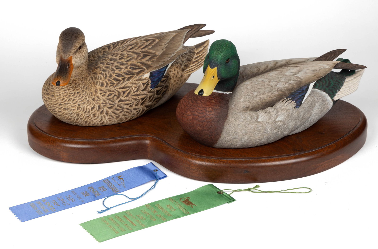 OUTSTANDING PAIR OF DAN WILLIAMS (NEW JERSEY) CARVED AND PAINTED MALLARDS: OUTSTANDING PAIR OF DAN WILLIAMS (NEW JERSEY) CARVED AND PAINTED MALLARDS, each with slightly turned head, glass eyes, finely articulated feathers and body, and outstanding painted surface, signed, da