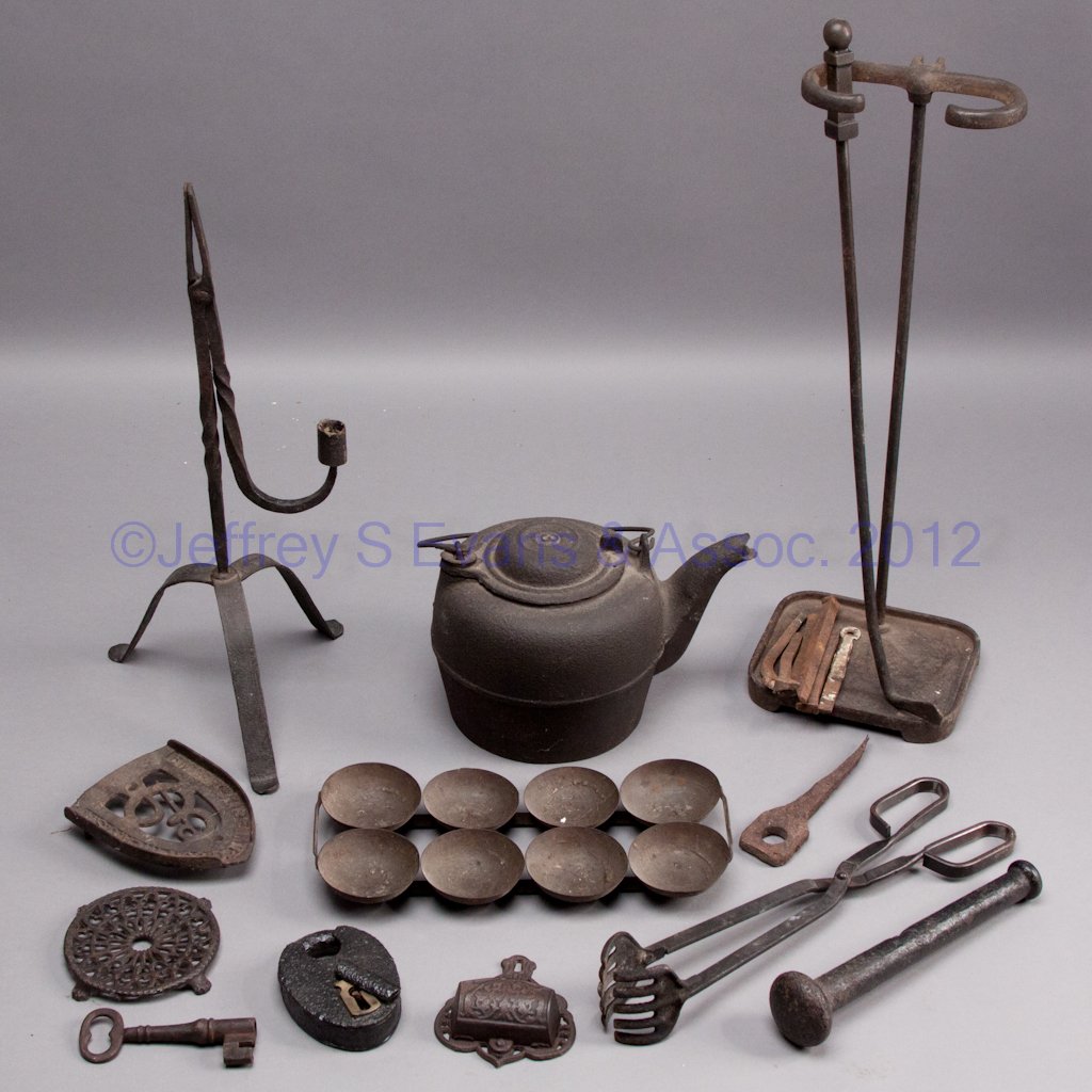 ASSORTED WROUGHT AND CAST-IRON ARTICLES: ASSORTED WROUGHT AND CAST-IRON ARTICLES, including a rushlight stand, match holder, kettle, etc. 19th and 20th century. Provenance: Collection of Leah and the late Bill Pollard, Purcellville, VA.