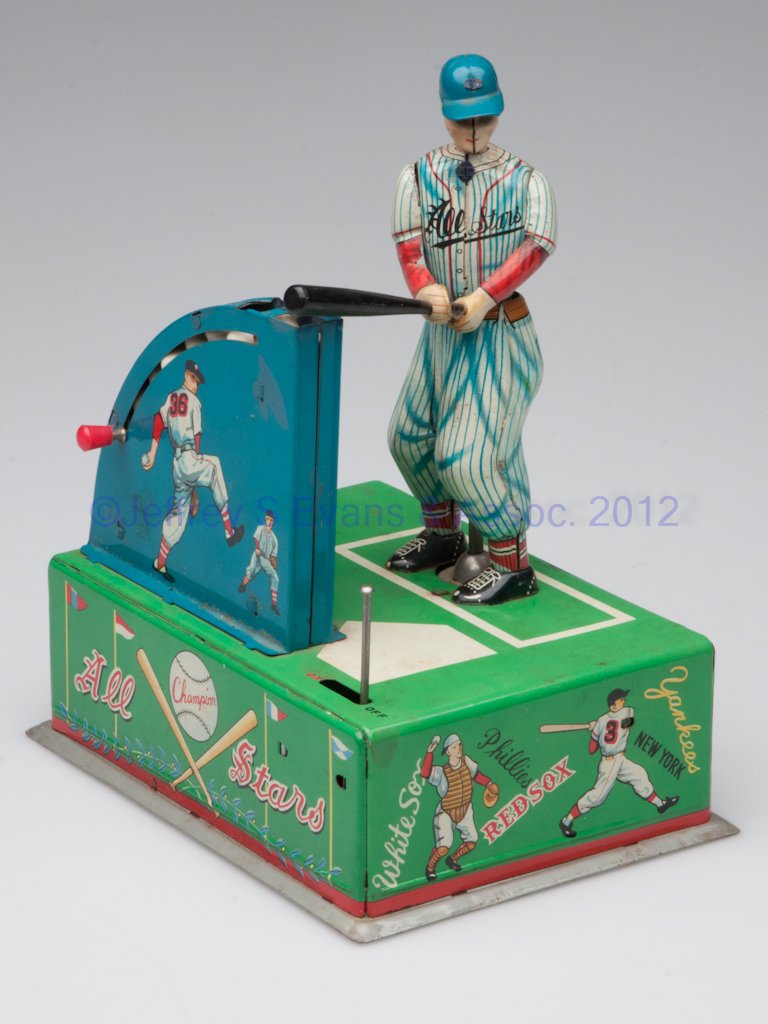 JAPANESE BATTERY OPERATED BASEBALL TIN TOY: JAPANESE BATTERY OPERATED BASEBALL TIN TOY, Mr. Baseball Jr., complete with seven balls, marked with K logo. Mid 20th century. 7 1/4" H.