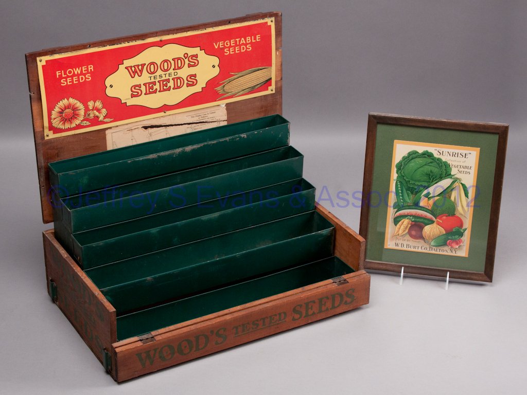 COUNTRY STORE WOOD AND TIN STORE SEED DISPLAY BOX: COUNTRY STORE WOOD AND TIN STORE SEED DISPLAY BOX, for Wood's Tested Seeds, Richmond, VA, hinged top and front with interior trays and stands to tilt for display. Along with an unrelated sign. Two pie